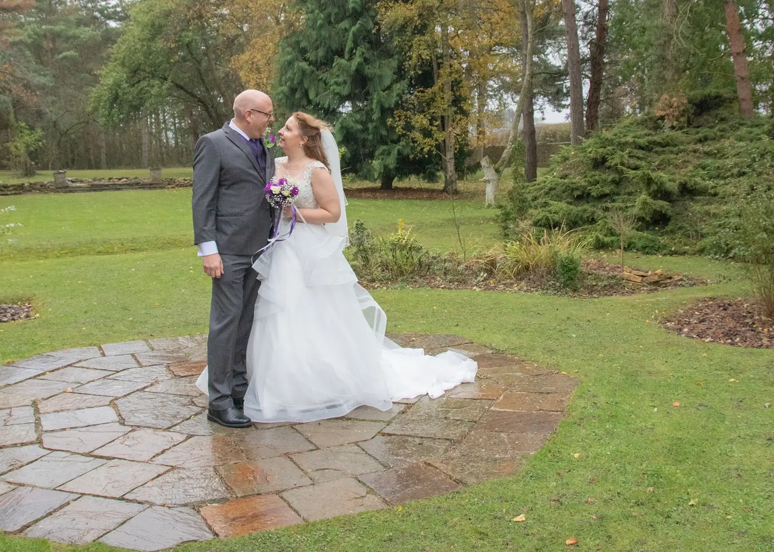 Bride and groom make the most of a break in the rain to get some outdoor photos