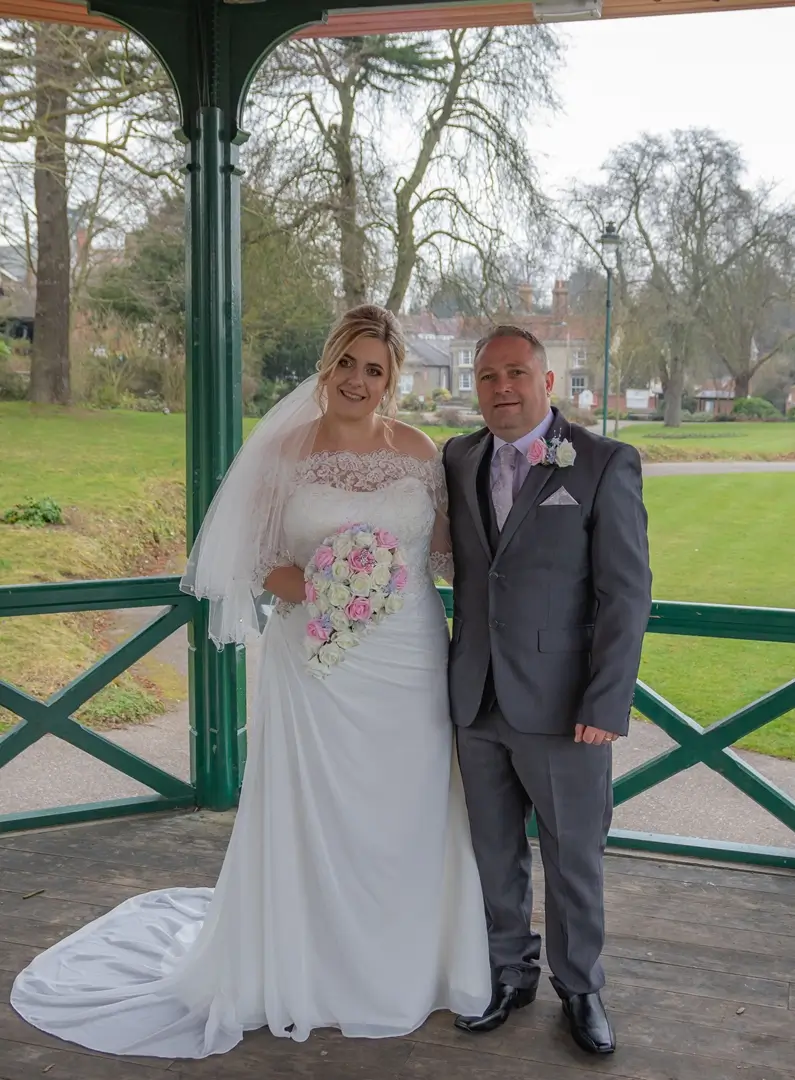 Bride and groom in the public gardens in Halstead