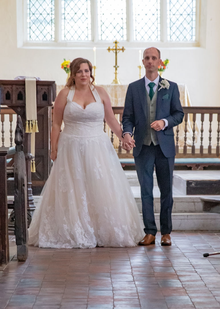 Bride and groom about to walk down the aisle after their wedding ceremony