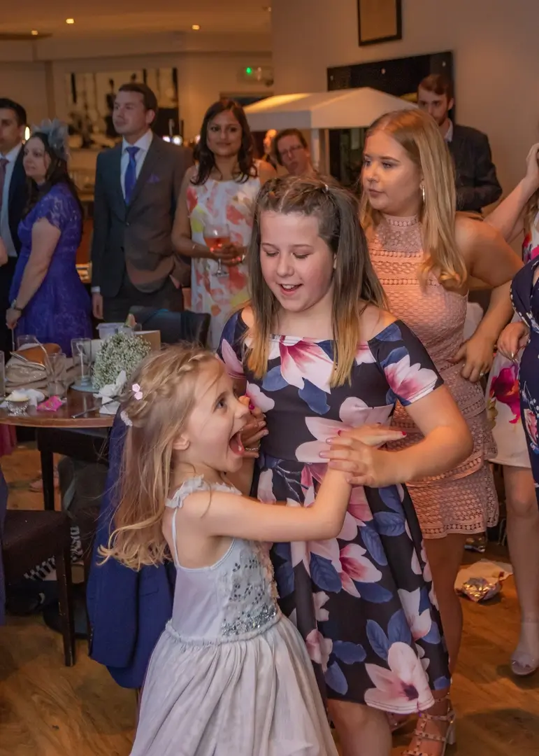 Young wedding guests having fun at an Essex wedding reception