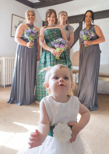 Flowergirl photobombs the bridal party at Prested Hall in Essex