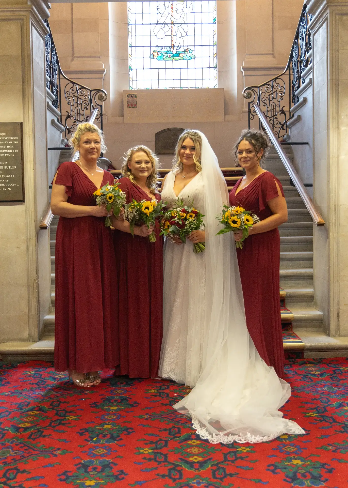 Bridal party in front of the staircase at Braintree Town Hall