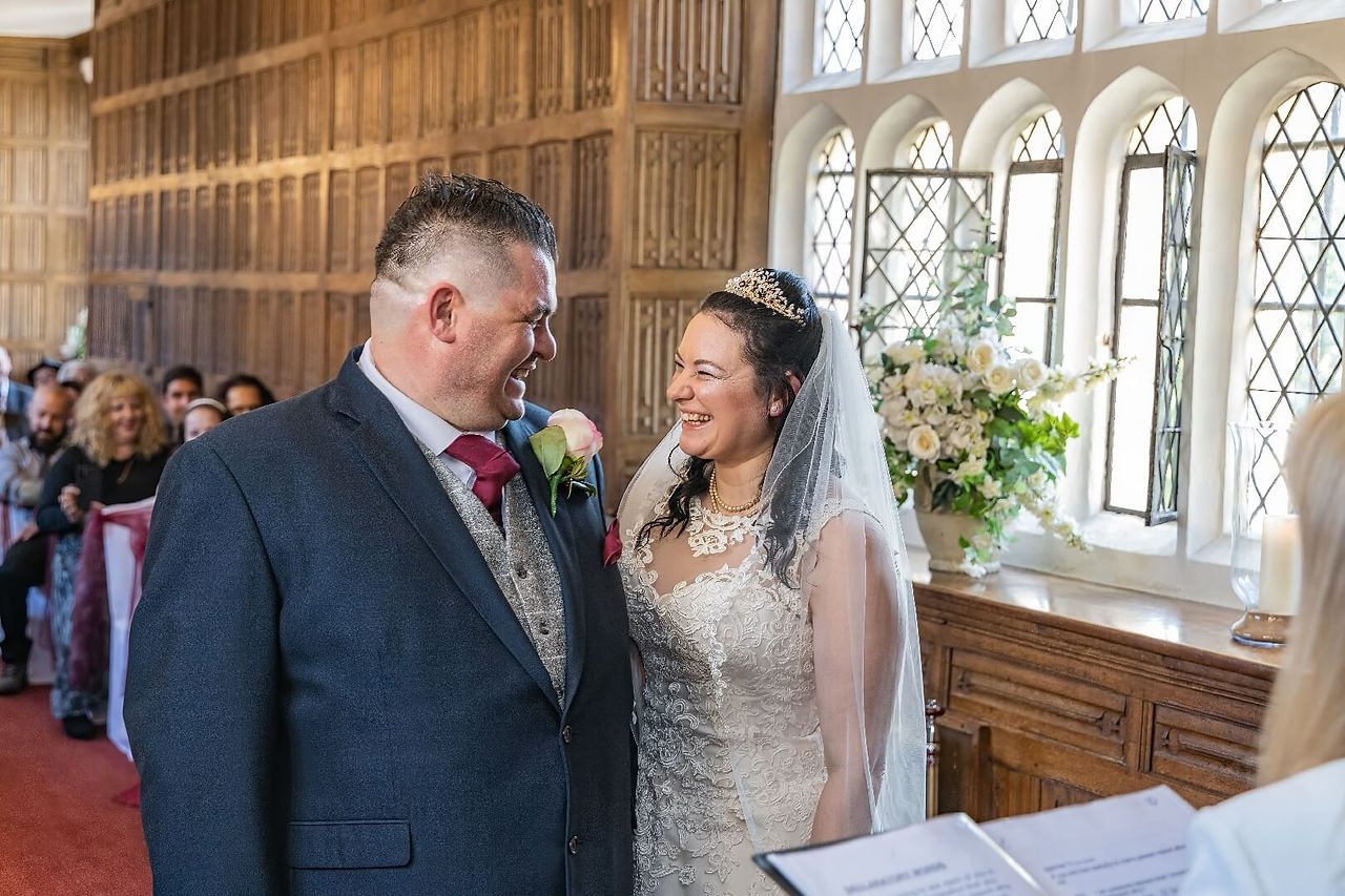 Bride and groom giggling Gosfield Hall