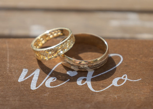 Wedding rings catch the sunlight at Prested Hall in Essex