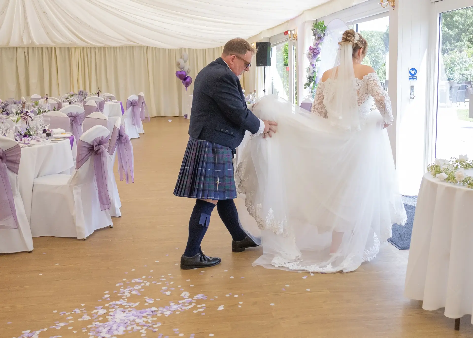 Bride and groom escape through a side door at The Fennes