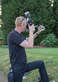 Essex wedding photographer taking a picture using a crystal ball
