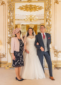 Bride with parents in the Rococo Suite at Gosfield Hall