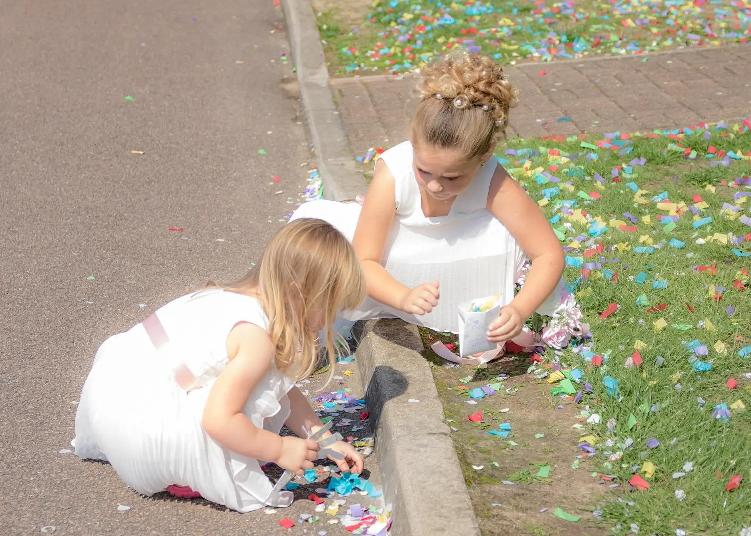 Flower girls playing with the fallen confetti at Holiday Inn, Orwell