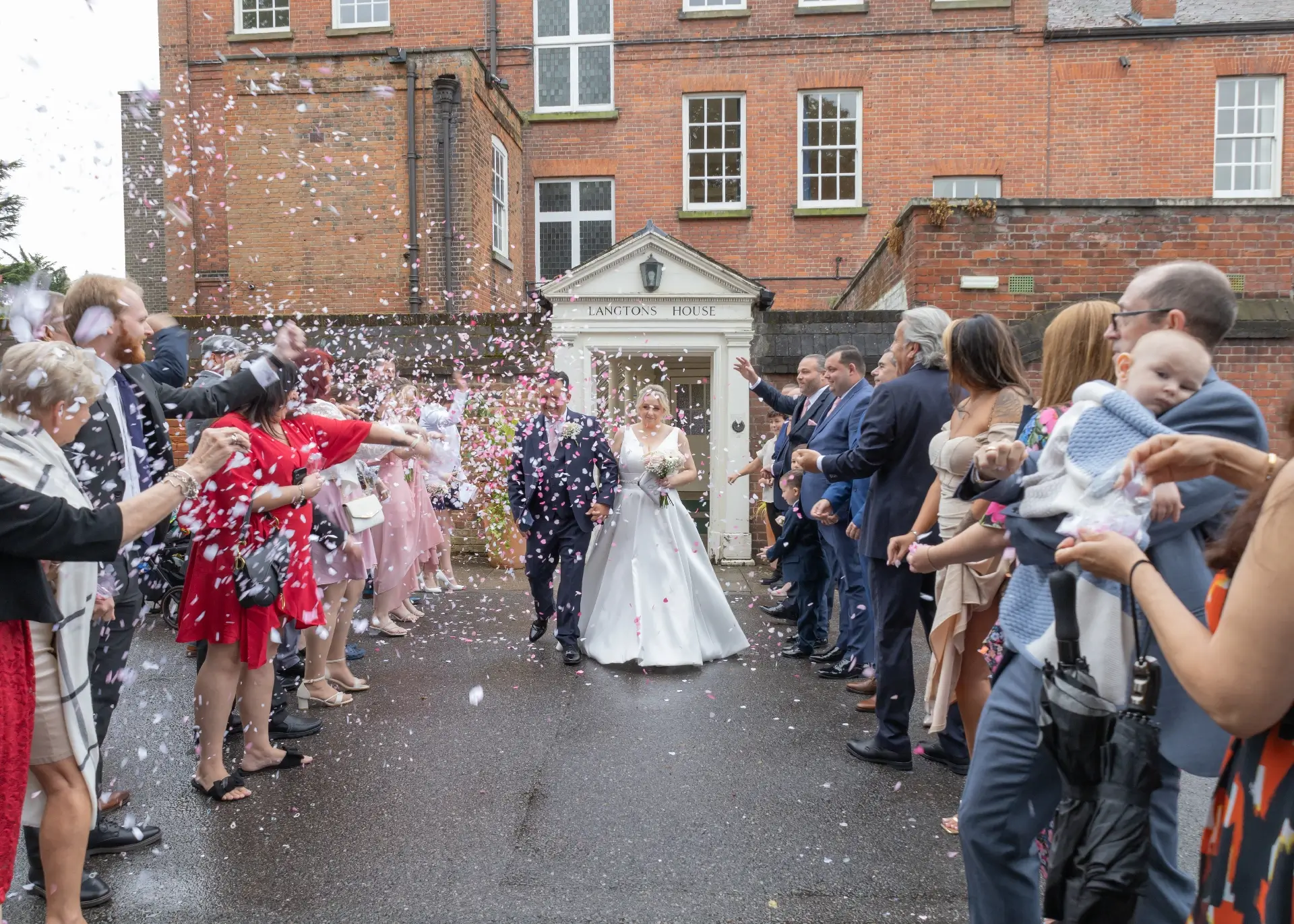 Wedding confetti in the rain at Langtons House