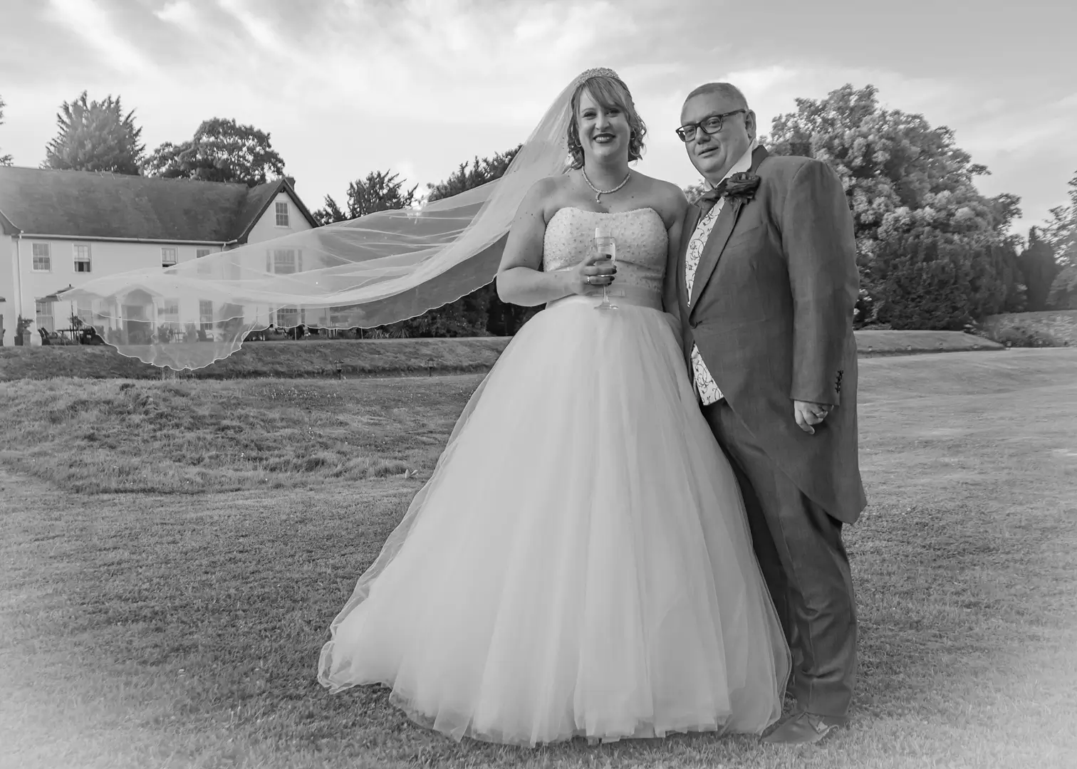 Bride and groom in the grounds at Sturmer Hall