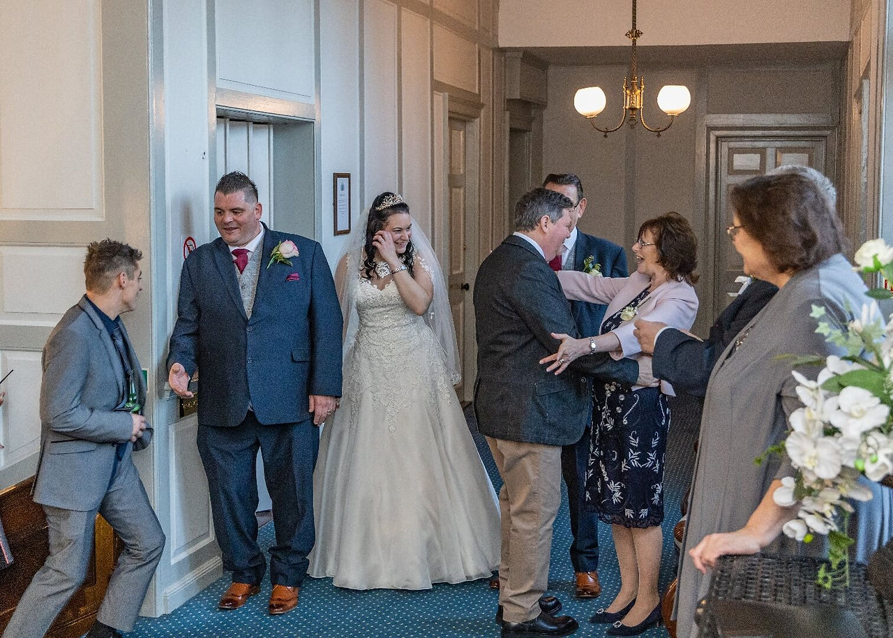 Bridal party in hallway Gosfield Hall