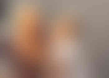 Bridesmaid having her make up done before getting dressed