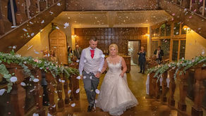 Bride and groom being showered in confetti at Layer Marney Tower