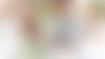 Bride and groom signing the register outdoors at Newland Hall