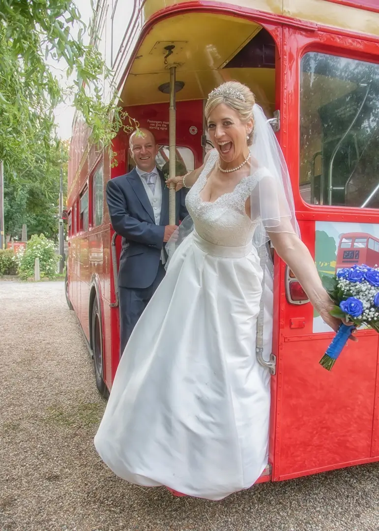 Bride and groom have fun with their wedding transport at Thee Lion Inn, Boreham