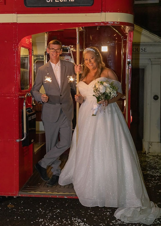 Bride-and-groom-red-double-decker-bus-with-sparklers-Langtons.jpg