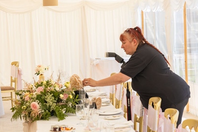 Essex wedding photographer arranging the rings and couples teddy bear ready for a picture at Prested Hall