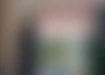 Helping put up a banner at the wedding reception venue