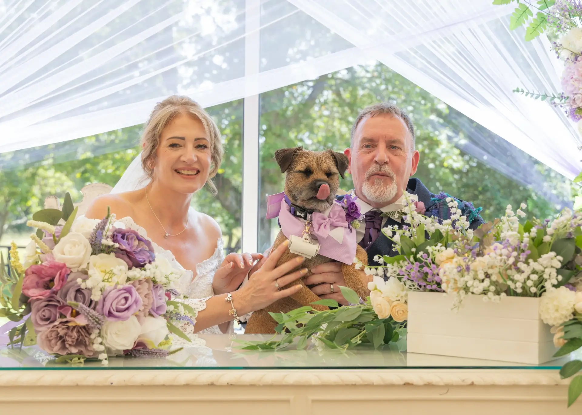 Bride and groom with their ring bearer at The Fennes