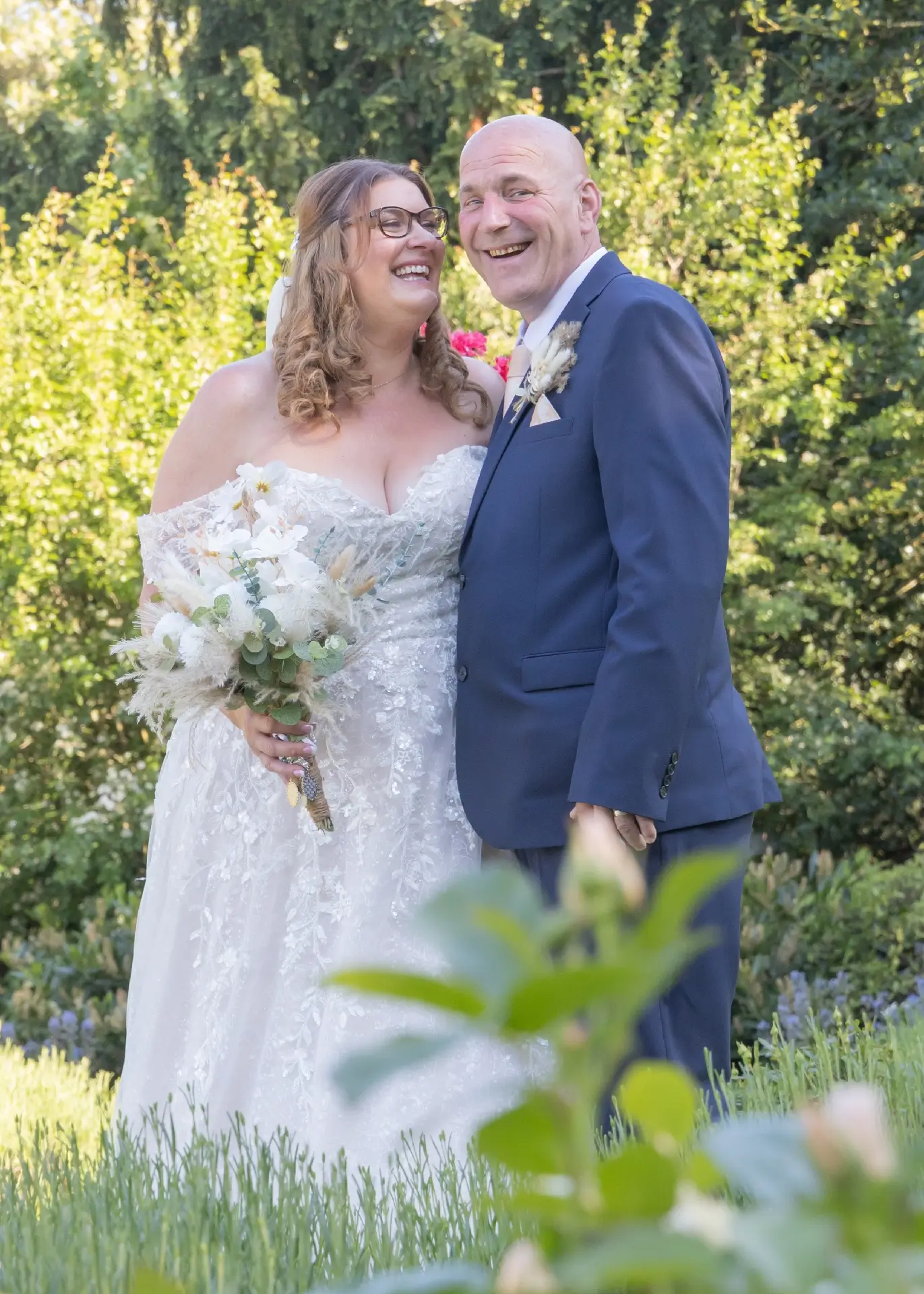 Bride and groom laughing together at Langtons House