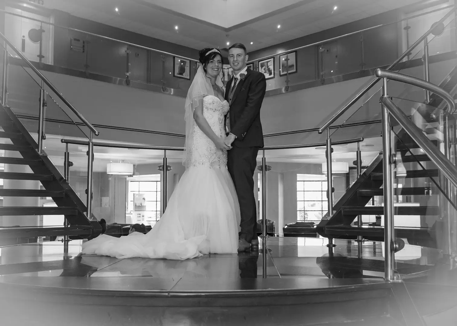 Bride and groom on the staircase at Five Lakes, Colchester