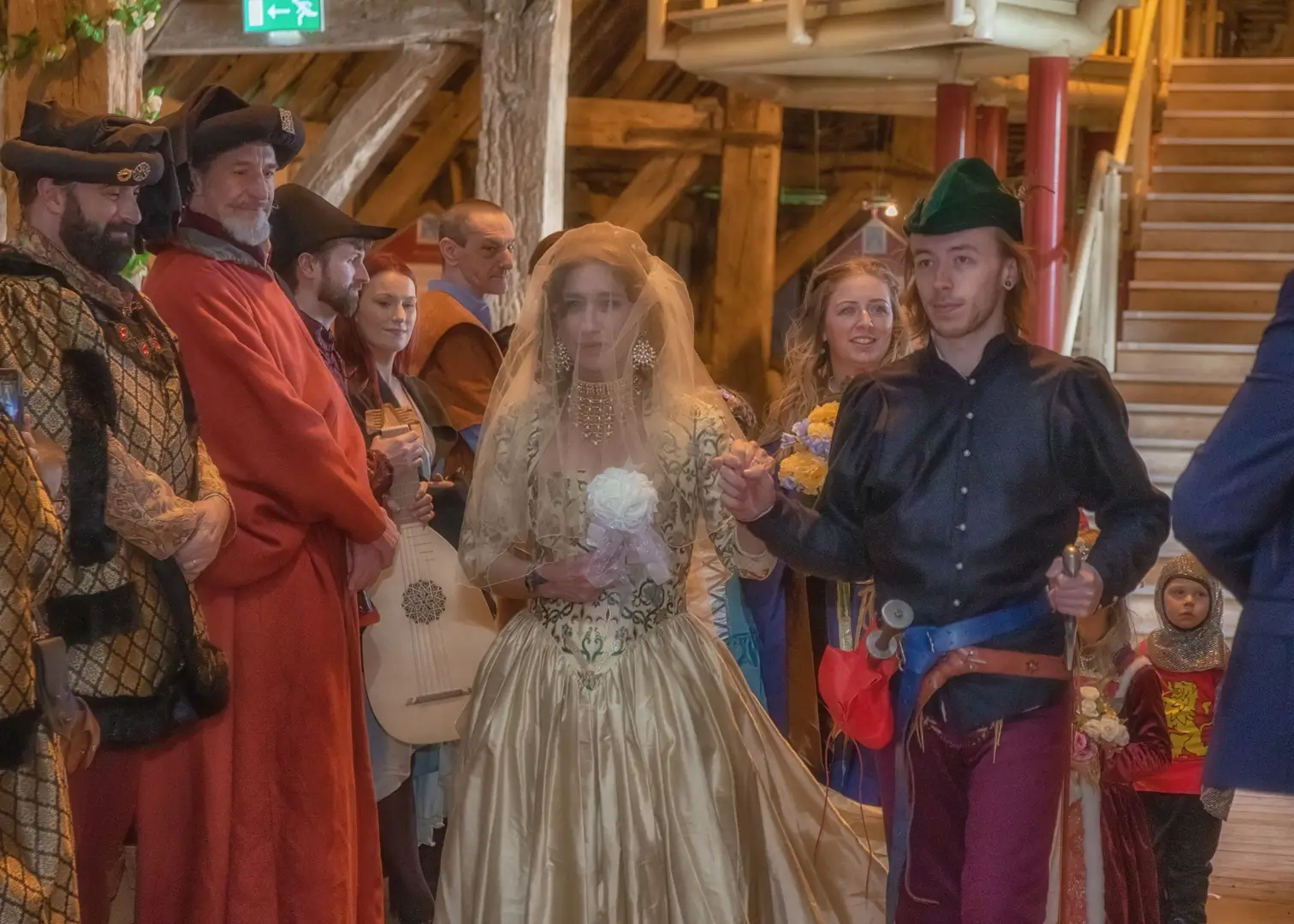 Brides entrance for her medieval themed wedding at Cressing Temple Barns