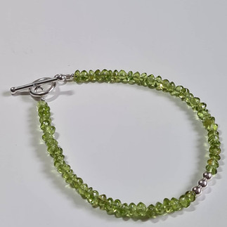 Peridot necklace on white background
