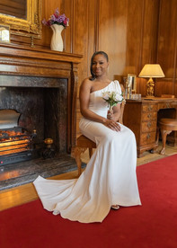 Bride sitting by fireplace at Braintree Town Hall