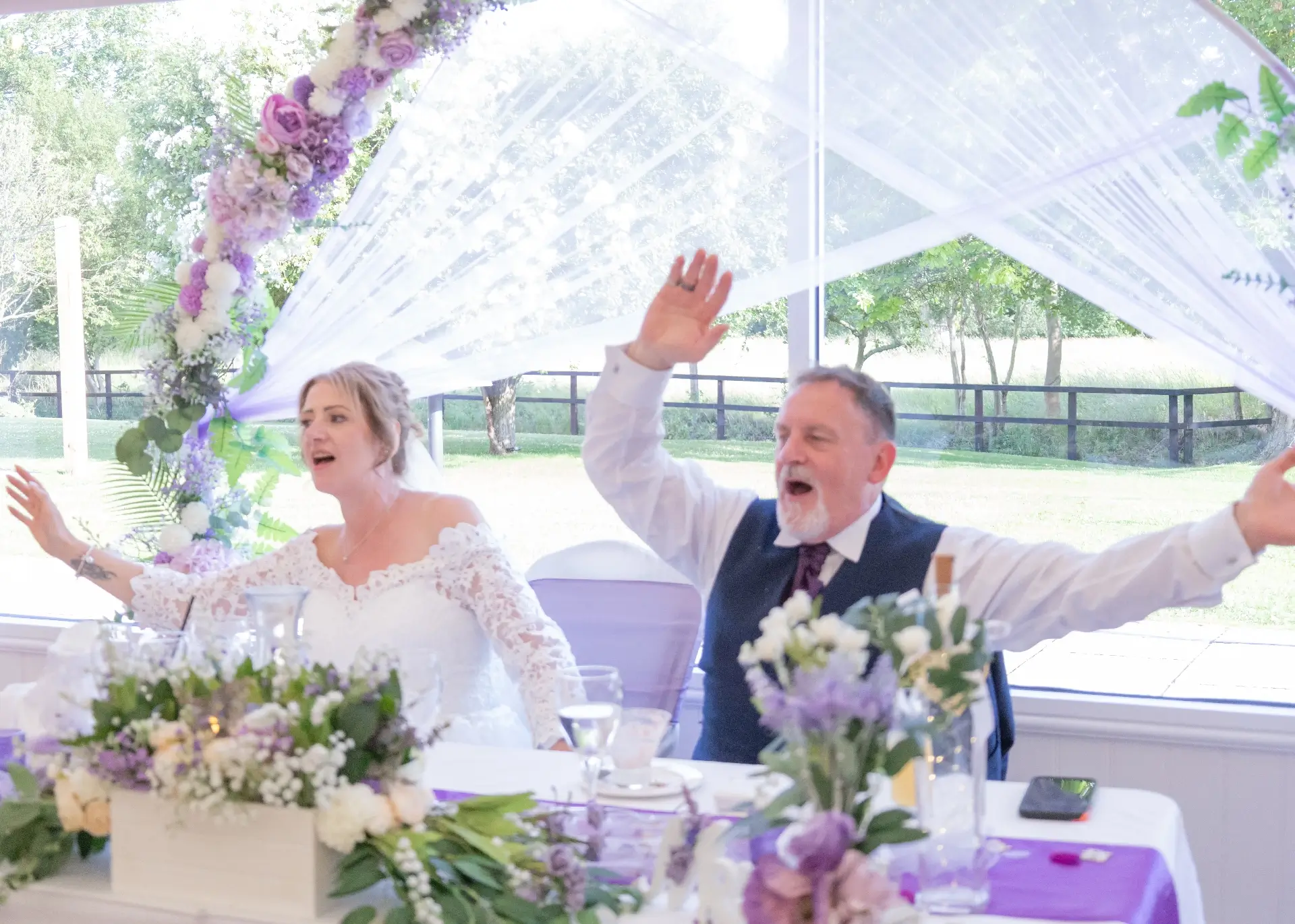 Bride and groom enjoying the wedding entertainment at The Fennes