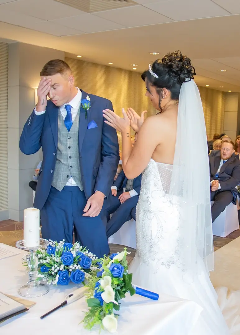 Groom shows his relief as he finishes his wedding vows at Five Lakes, Colchester