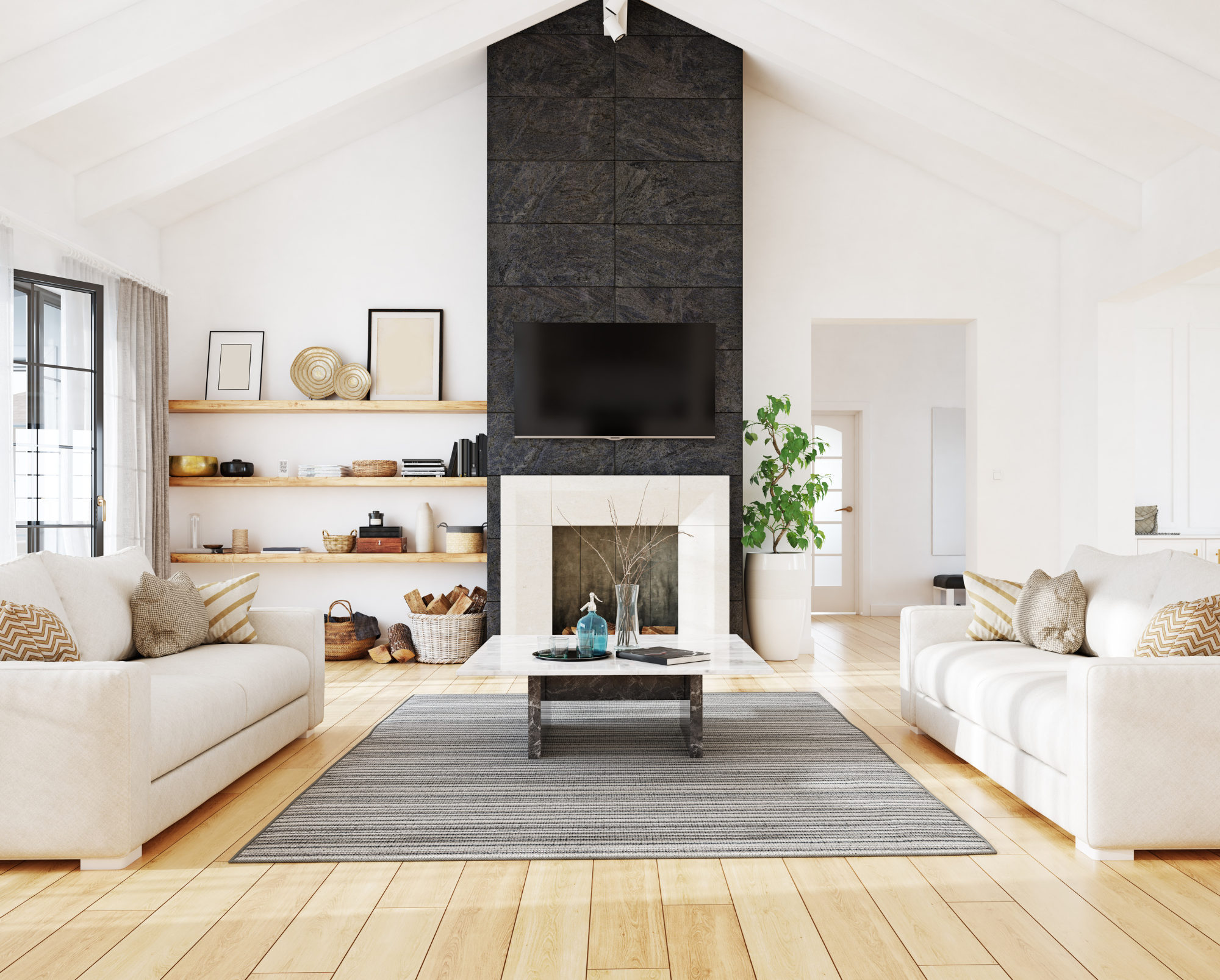Bright modern living room with white sofas, black stone fireplace, TV, shelves, plants, and sunlight on pale wood floors