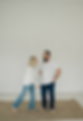 couple holding hands and smiling