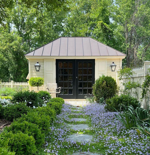 Custom-designed backyard home office structure, offering a private and serene workspace environment, perfect for remote work