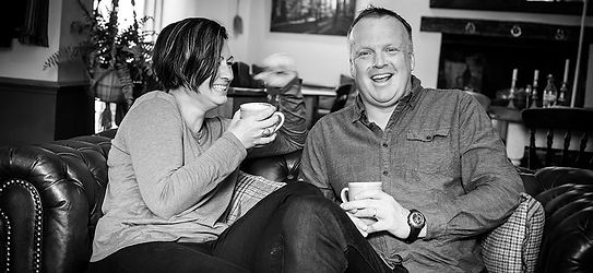 The two founders behind Exmoor Tea sat chatting with mugs of tea