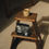 Thumbnail: Origin Coffee Stronghold Blend 250g sat on a stool with a cup of coffee