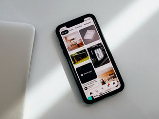 iPhone displaying Pinterest app on screen.
