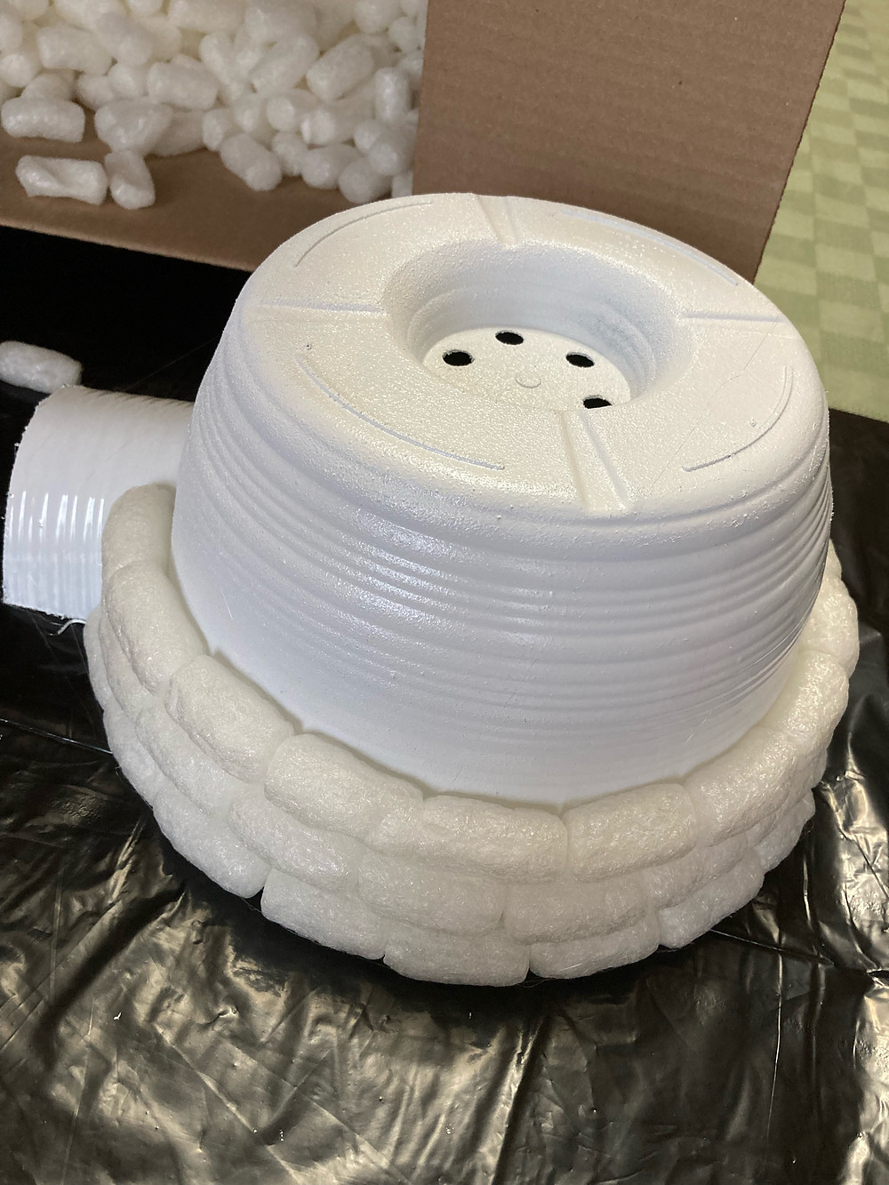 Hot Glue Packing Peanuts to Planter to Make a Styrofoam Igloo