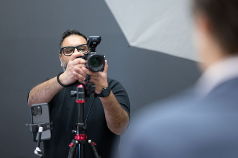 Photographer taking conference headshots at GTA event