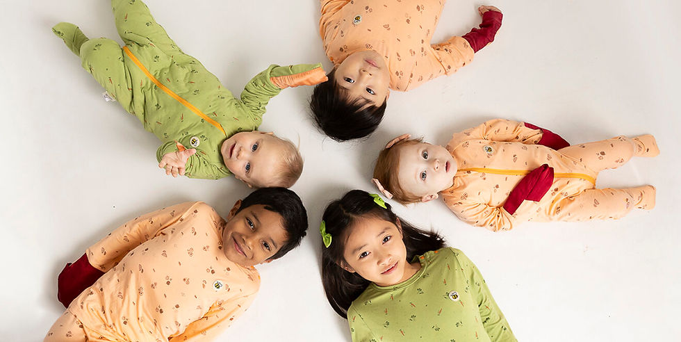 Children wearing soft natural-fibre clothing suitable for eczema-prone skin