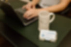 Travel agent typing on computer