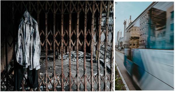 Sebuah baju digantung di pintu teralis besi gedung yang tebengkalai dan sebuah Transjakarta yang melaju di jalan Pintu Besar Selatan. (Fernando Randy/Historia.id).