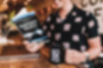 Man reading a book to help become an expert in digital marketing and thought leadership.