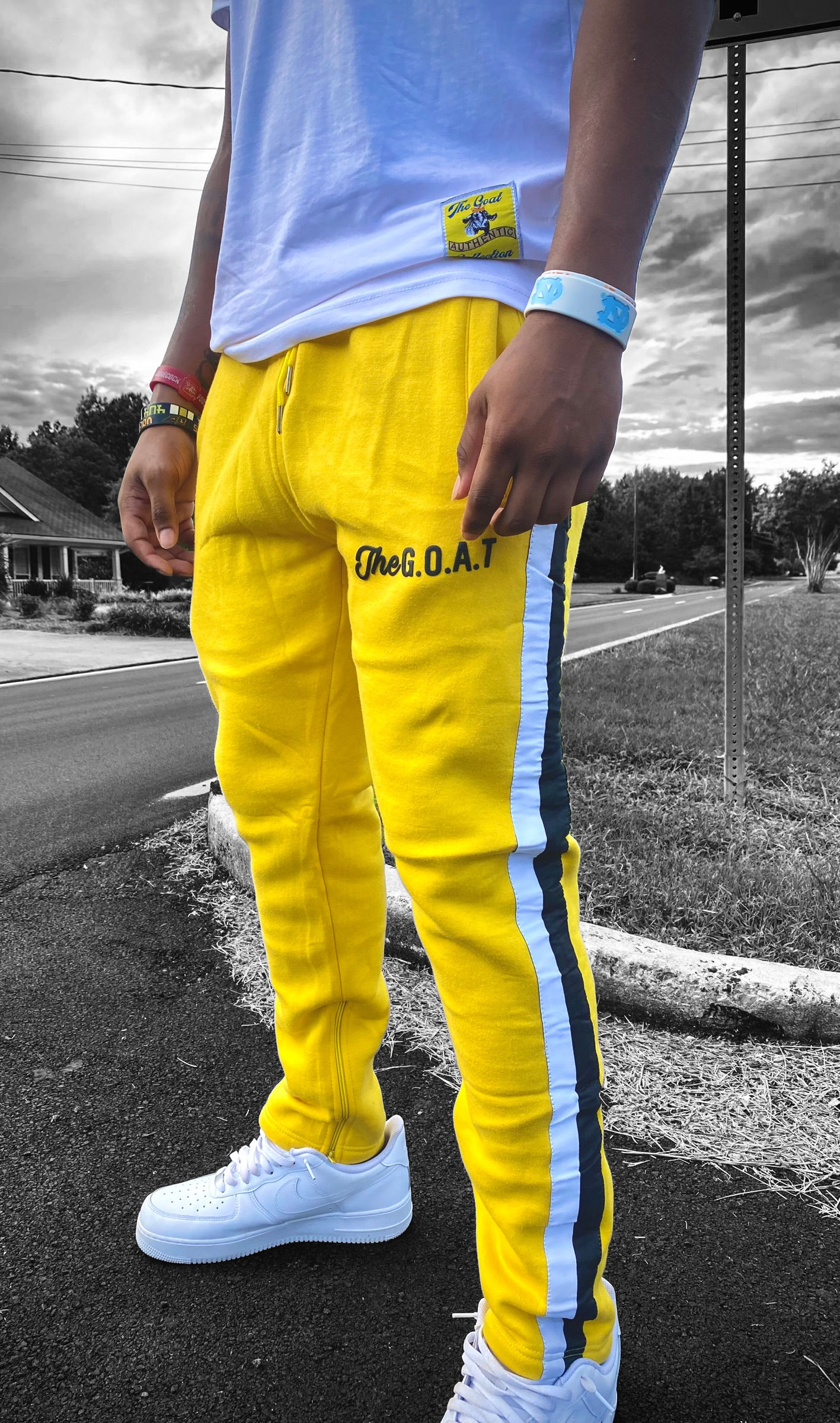 Yellow/Mustard The G.O.A.T signature joggers with brick lettering.
