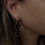 Thumbnail: Melted Circle Gold Earrings