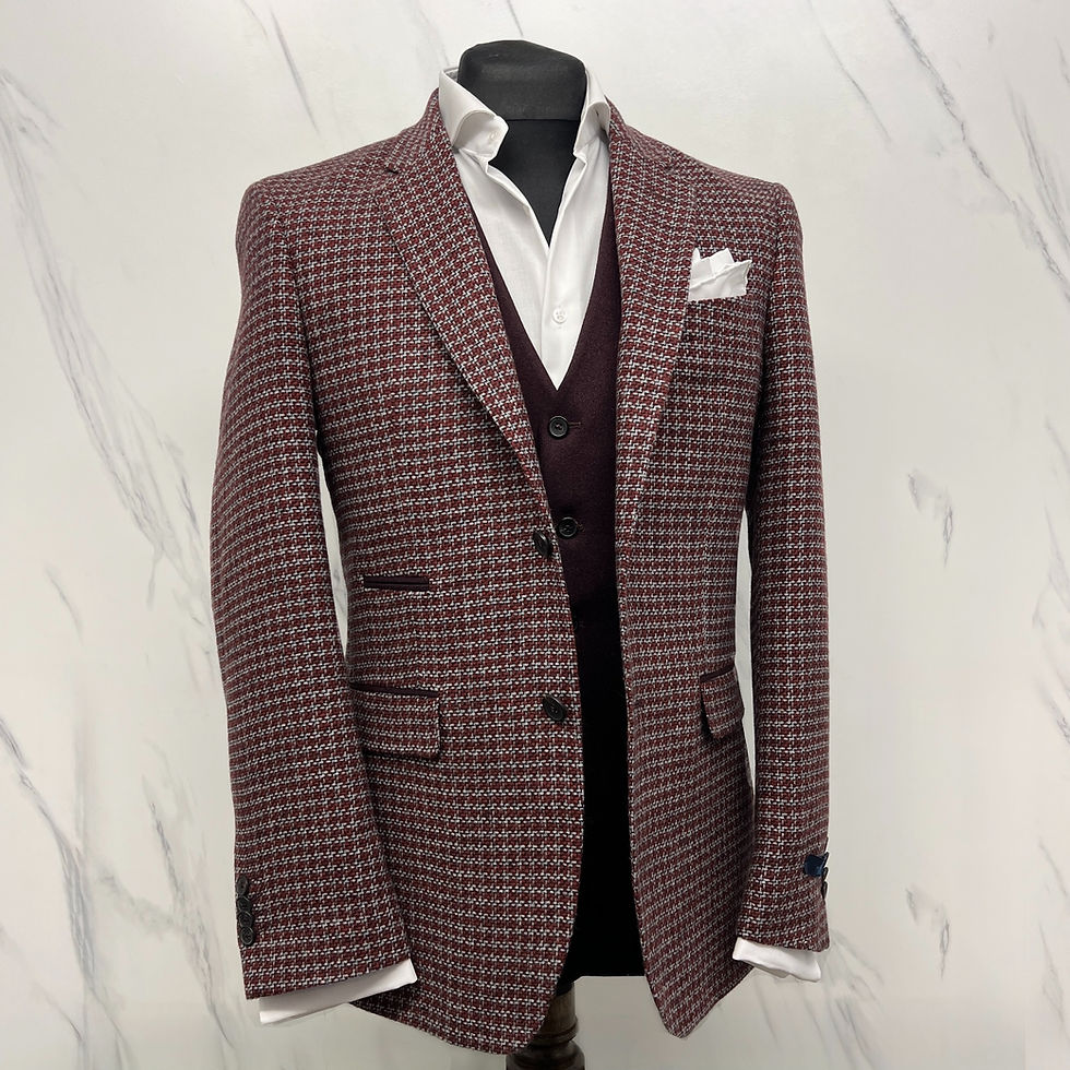 Burgundy houndstooth blazer with white shirt and dark waistcoat on mannequin.