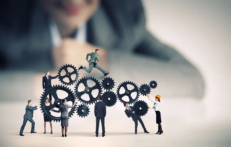Businesswoman looking at team of businesspeople in miniature-1.webp