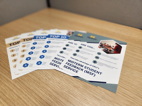 A fanned-out stack of promotional flyers for the University of Michigan CRLT "MIDTERM STUDENT FEEDBACK (MSF) SERVICE" on a wooden table.