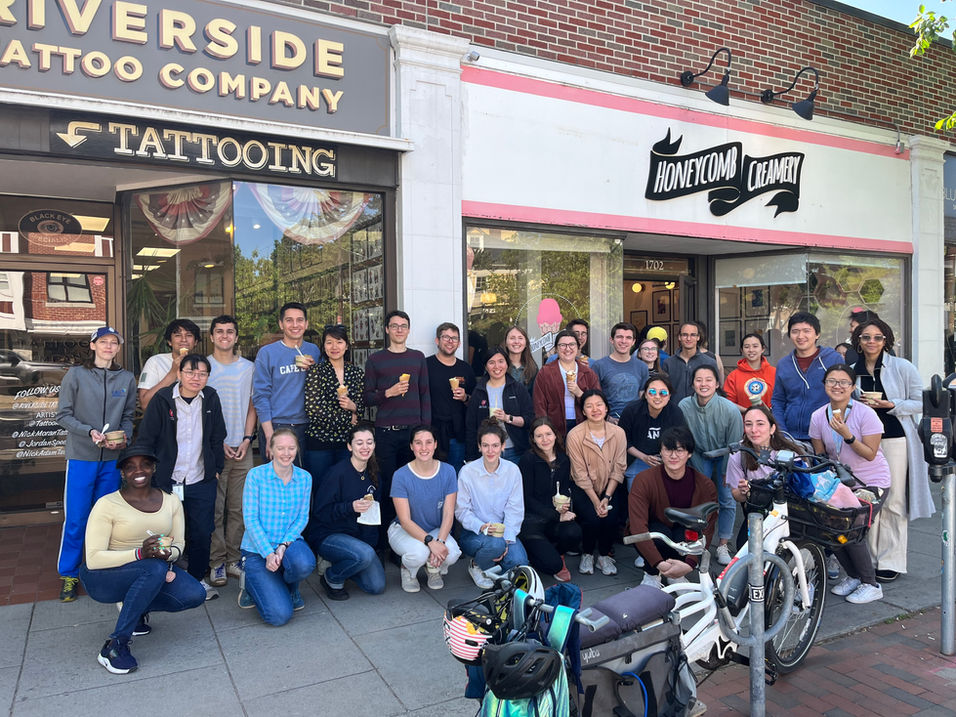 A successful turnout for our ice cream walk to Honeycomb Creamery! A large group of HWIC+ members stand in front of the ice cream shop.