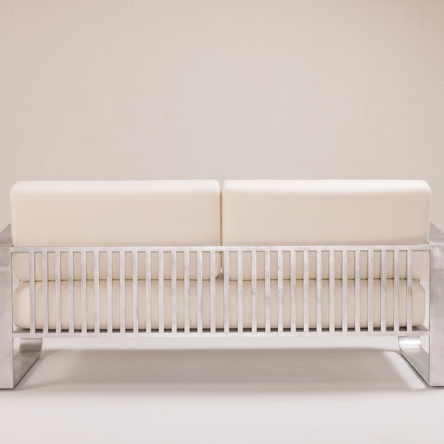 NUWA Collection by Shana Willinsky for CMA Furnishings featuring minimalist outdoor furniture with clean lines, soft proportions, and natural materials designed to harmonize with architectural spaces.