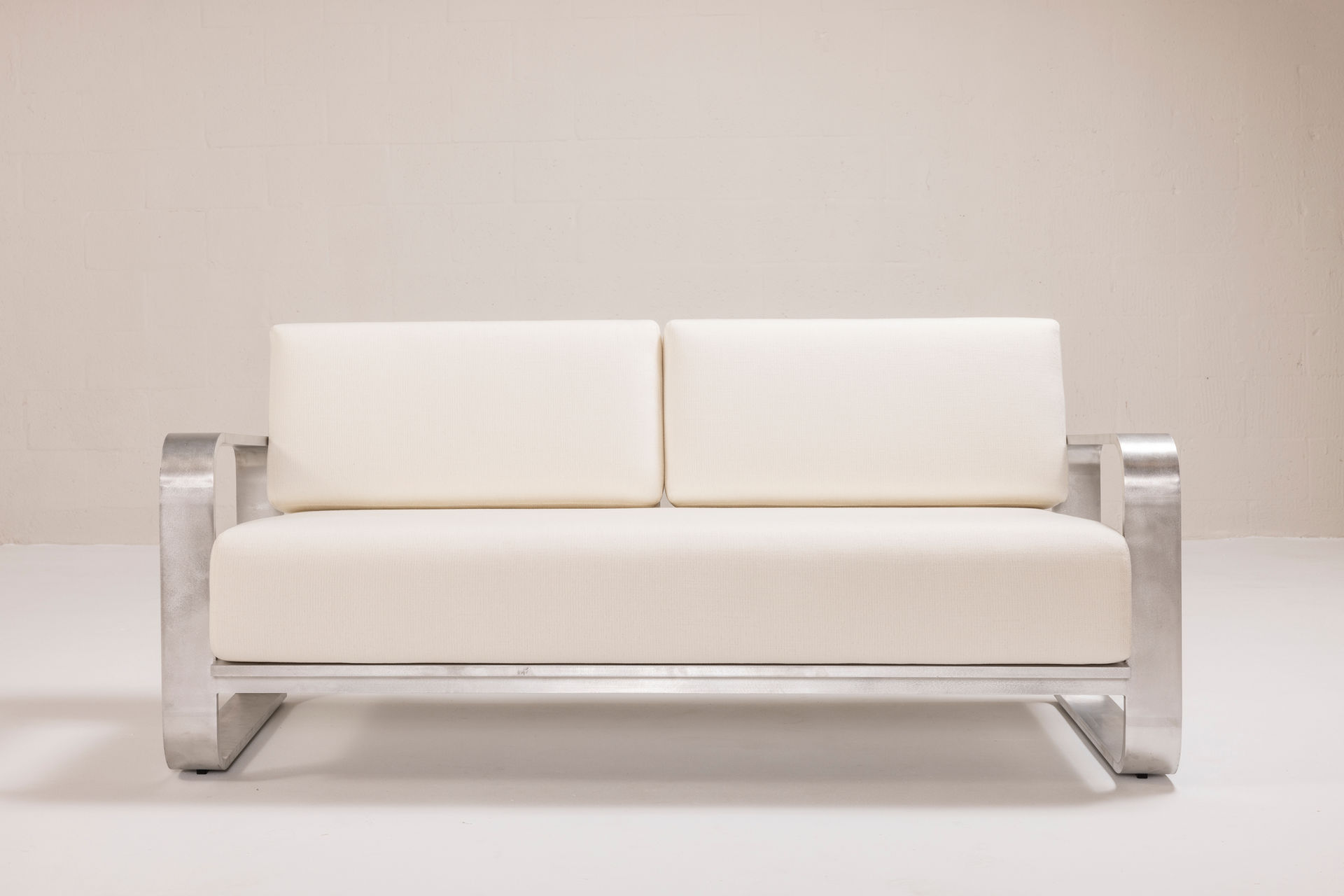 NUWA Collection by Shana Willinsky for CMA Furnishings featuring minimalist outdoor furniture with clean lines, soft proportions, and natural materials designed to harmonize with architectural spaces.